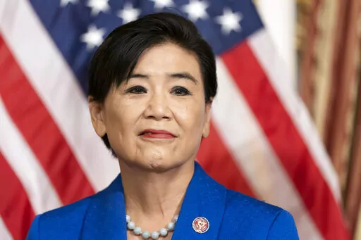 FILE- Rep. Judy Chu, D-Calif., stands before House Speaker Nancy Pelosi of Calif., signs H.R. 3525, the Commission to Study the Potential Creation of a National Museum of Asian Pacific American History and Culture Act during a ceremony on Capitol Hill, June 7, 2022, in Washington. The leaders of a new House select committee on China defended Democratic Rep. Judy Chu on Sunday, Feb. 26, 2023, saying it was abhorrent and unacceptable for a GOP lawmaker to question her loyalty to the United States 
