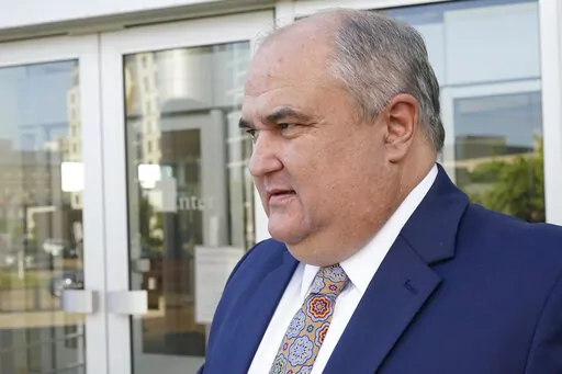 John Davis, former director of the Mississippi Department of Human Services, leaves the Thad Cochran United States Courthouse in Jackson, Miss., on Sept. 22, 2022. A federal judge signed an order Friday, Jan. 27, 2023, to indefinitely delay sentencing of the former Mississippi welfare director in a case about misspending money that was intended to help needy families in one of the poorest states in the U.S. (AP Photo/Rogelio V. Solis, File)