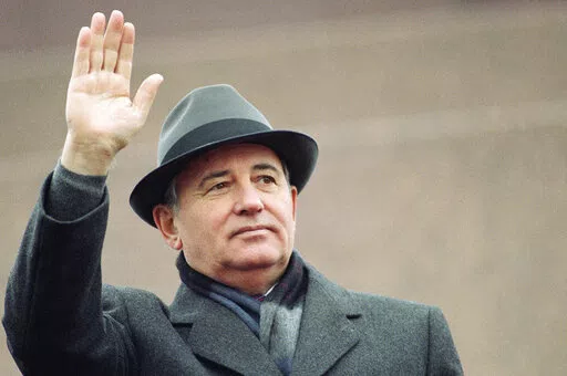Soviet President Mikhail Gorbachev waves from the Red Square tribune during a Revolution Day celebration, in Moscow, Soviet Union, Tuesday, Nov. 7, 1989. Russian news agencies are reporting that former Soviet President Mikhail Gorbachev has died at 91. The Tass, RIA Novosti and Interfax news agencies cited the Central Clinical Hospital. (AP Photo/Boris Yurchenko, File)