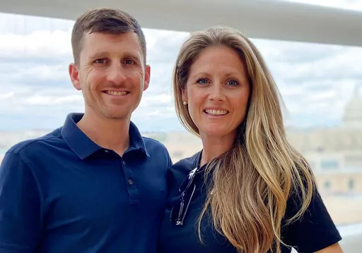 In this undated photo provided by Bobi Gephart, Gephart and her husband, Nate Gephart, pose for a picture. Bobi says she has felt "overwhelming support" from people all over the world after she confronted Pastor John B. Lowe II. (Courtesy of Bobi Gephart via AP)