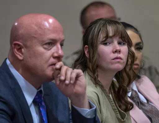 Hannah Gutierrez-Reed, center, sits with her attorney Jason Bowles and paralegal Carmella Sisneros during her sentencing hearing in Santa Fe, New Mexico, on Monday, April 15, 2024. Gutierrez-Reed, the armorer on the set of the Western film "Rust," was sentenced to 18 months in prison for involuntary manslaughter in the death of cinematographer Halyna Hutchins, who was fatally shot by Alec Baldwin in 2021. (Eddie Moore/The Albuquerque Journal via AP, Pool)