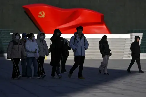 People walk past a sculpture of the Chinese Communist Party flag at the Museum of the Communist Party of China, in Beijing on Jan. 14, 2025. (AP Photo/Andy Wong)