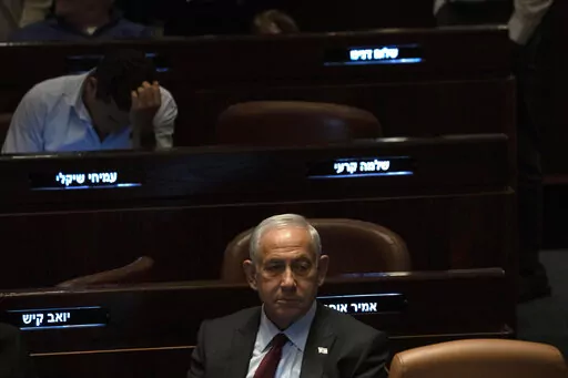 Israeli Prime Minister designate Benjamin Netanyahu, center, pauses during a session after Yariv Levin was selected as Speaker of the Knesset, Israel's parliament, in Jerusalem, Tuesday, Dec. 13, 2022. Over 1,000 senior Israeli air force veterans, including a former Israeli chief of staff, on Monday, Dec. 26, 2022, urged the country’s top legal officials to stand tough against the incoming government, saying the alliance of religious and ultranationalist parties threatens Israel’s future.(AP