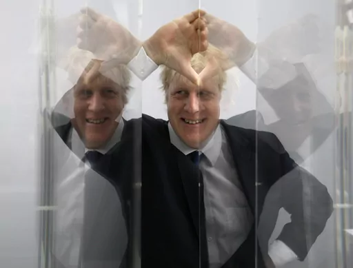 Boris Johnson, then Mayor of London looks through perspex as models of the next two commissions that will appear on the fourth plinth in Trafalgar Square are unveiled, in London, Friday, Jan. 14, 2011. He was the mayor who reveled in the glory of hosting the 2012 London Olympics, and the man who led the Conservatives to a whopping election victory on the back of his mission to “get Brexit done.” But Boris Johnson’s time as prime minister was marred by his handling of the coronavirus pandem