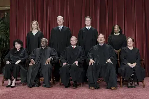 Members of the Supreme Court sit for a new group portrait following the addition of Associate Justice Ketanji Brown Jackson, at the Supreme Court building in Washington, Oct. 7, 2022. Bottom row, from left, Justice Sonia Sotomayor, Justice Clarence Thomas, Chief Justice John Roberts, Justice Samuel Alito, and Justice Elena Kagan. Top row, from left, Justice Amy Coney Barrett, Justice Neil Gorsuch, Justice Brett Kavanaugh, and Justice Ketanji Brown Jackson. The Supreme Court is adopting its first