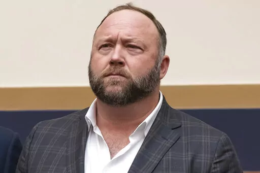 This Tuesday, Dec. 11, 2018, photo shows radio show host and conspiracy theorist Alex Jones at Capitol Hill in Washington. Jones was being questioned Wednesday, April 6, 2022, by lawyers for families of Sandy Hook Elementary School victims in Connecticut, where a judge had ordered the Infowars host to face mounting fines until he appeared for a deposition. (AP Photo/J. Scott Applewhite, File)