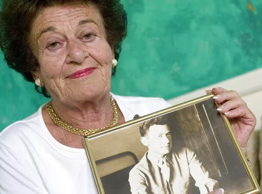 Gerda Weissmann Klein holds a picture of her late husband, Kurt Klein, the U.S. soldier who rescued her from the Holocaust, at her home in Scottsdale, Ariz., on Aug. 24, 2005. Weissmann Klein, a Holocaust survivor and author who wrote about her ordeal and went on to receive the Presidential Medal of Freedom, will be remembered at a memorial May 1 after her death in Phoenix earlier this month. Klein died April 3, 2022 in Phoenix, where she had lived since 1985. She was 97. (Pat Shannahan/The Ariz