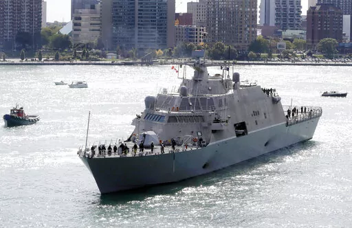 The USS Detroit, a Freedom-class of littoral combat ship, arrives Friday, Oct. 14, 2016, in Detroit. The Navy that once wanted smaller, speedy warships to chase down pirates has made a speedy pivot to Russia and China and many of those ships, like the USS Detroit, could be retired. The Navy wants to decommission nine ships in the Freedom-class, warships that cost about $4.5 billion to build. (AP Photo/Carlos Osorio, File)