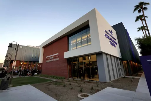 The Jerry Colangelo Museum at Grand Canyon University is seen at at dusk in Phoenix, on Sept. 20, 2017. Grand Canyon University, the country's largest Christian university, is being fined $37.7 million by the federal government amid accusations that it misled students about the cost of its graduate programs. (AP Photo/Matt York, File)