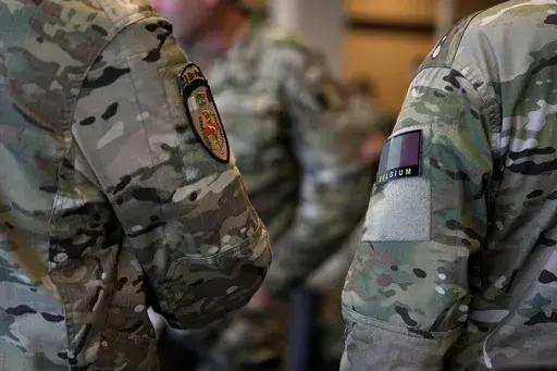 Soldiers from Belgium and Luxembourg line up as they prepare to board a military transport plane at Melsbroek Military Airport in Melsbroek, Belgium, July 4, 2023. (AP Photo/Virginia Mayo, File)