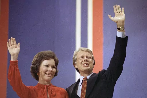 Jimmy Carter, right, and his wife, Rosalynn Carter, wave together at the National Convention in Madison Square Garden, July 15, 1976, in New York. Rosalynn Carter, the closest adviser to Jimmy Carter during his one term as U.S. president and their four decades thereafter as global humanitarians, died Sunday, Nov. 19, 2023. She was 96. (AP Photo, File)