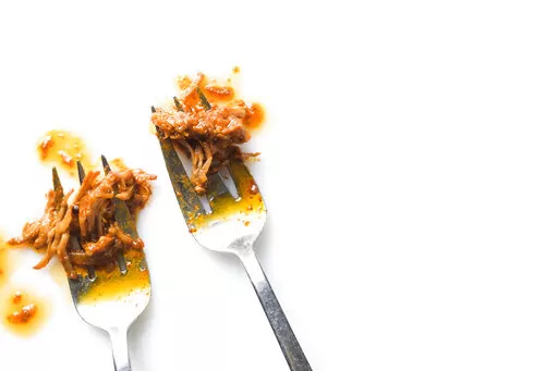 This image released by Milk Street shows a recipe for Miso-Gochujang Shredded Pork. (Milk Street via AP)