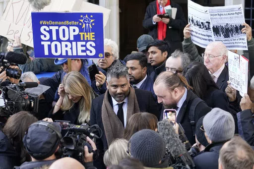Lawyer Tofique Hossain addresses the media outside the Supreme Court in London, Wednesday, Nov. 15, 2023. Britain's Supreme Court has ruled that the government's contentious plan to send some migrants on a one-way trip to Rwanda is illegal. Five justices on the country's top court said Wednesday that asylum-seekers would be "at real risk of ill-treatment" because they could be sent back to their home countries once they were in Rwanda.The ruling is a major blow to a key government policy that ha
