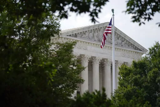 An American flag waves in front of the U.S. Supreme Court building, Monday, June 27, 2022, in Washington. (AP Photo/Patrick Semansky, File)