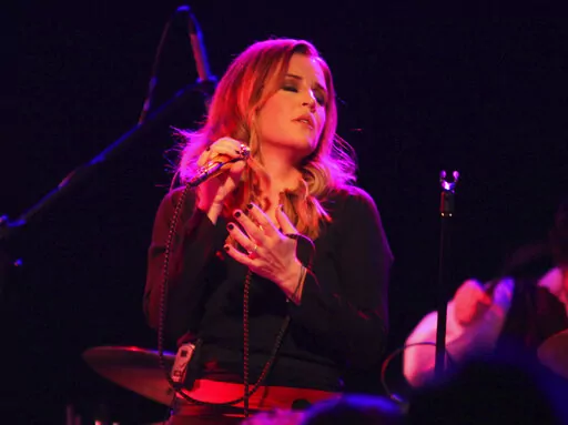 Lisa Marie Presley performs during her Storm & Grace tour on June 20, 2012, at the Bottom Lounge in Chicago. She was dubbed a “rock princess,” but Lisa Marie Presley staked her own musical claim as a singer-songwriter, allowing her to express herself apart, but sometimes alongside, from her iconic lineage.(Photo by Barry Brecheisen/Invision/AP, File)
