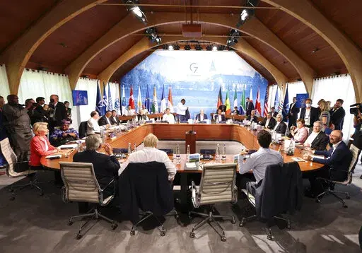 A general view of a G7 leaders meeting with outreach guests as part of the working session of the G7 leaders summit at Castle Elmau in Kruen, near Garmisch-Partenkirchen, Germany, on Monday, June 27, 2022. The Group of Seven leading economic powers are meeting in Germany for their annual gathering Sunday through Tuesday. (Lukas Barth/Pool Photo via AP)