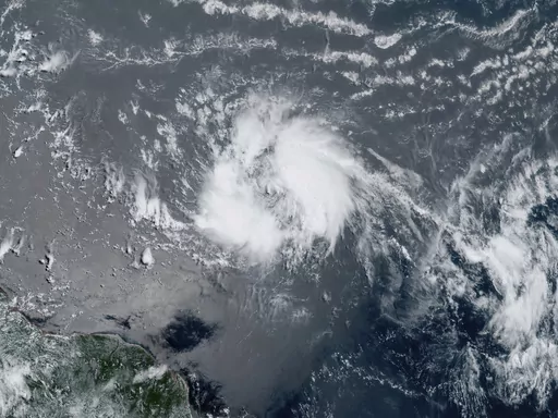 This GeoColor satellite image taken Tuesday, June 20, 2023 and provided by NOAA, shows Tropical Storm Bret as it chugged toward the eastern Caribbean. (NOAA via AP)