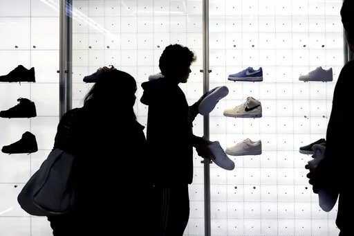 People shop for shoes in a Nike store on , Nov. 25, 2022, in New York. “Buy now, pay later” services like Affirm, Afterpay and Klarna can sometimes provide a cheaper, more accessible version of credit. These services essentially provide customers an alternative way to pay for purchases over time without going into credit card debt or taking out a traditional personal loan. Travel purchases, such as airfare and vacation rentals, are the fastest-growing segment for buy now, pay later services.