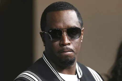 In this May 30, 2018, file photo, Sean "Diddy" Combs arrives at the LA Premiere of "The Four: Battle For Stardom" at the CBS Radford Studio Center in Los Angeles. Combs' lawyer said Tuesday, March 26, 2024, that the searches of his Los Angeles and Miami properties by federal authorities in a sex-trafficking investigation were ”a gross use of military-level force" and that Combs is “innocent and will continue to fight" to clear his name. (Photo by Willy Sanjuan/Invision/AP, File)