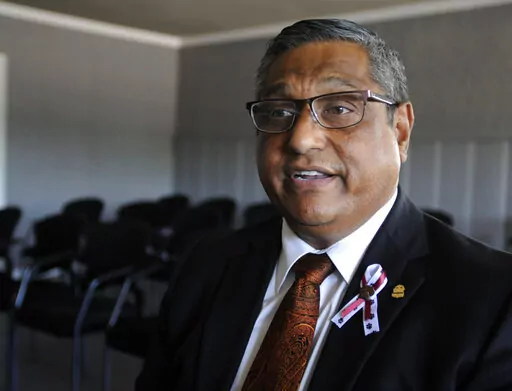 Gilbert Limones, one of the first targets of a gunman who killed 21 people at an elementary school, speaks during an interview at the church he pastors in Uvalde, Texas, on Sunday, June 5, 2022. Limones, who came under fire outside the funeral home where he works near the school, wasn't hurt and has since helped prepare some of the young victims for burial. (AP Photo/Jay Reeves)