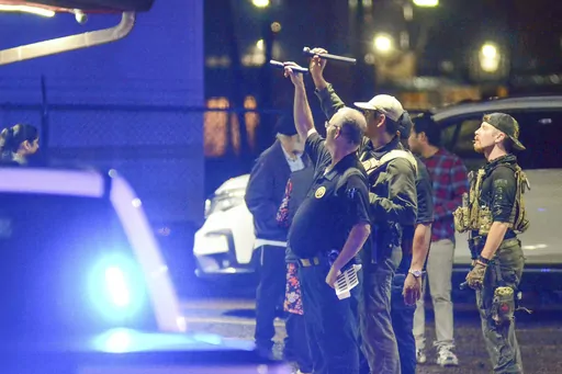 Police investigate the scene of a shooting that wounded several people Saturday, Dec. 2, 2023, in McComb, Miss. (Matt Williamson/The Enterprise-Journal via AP)