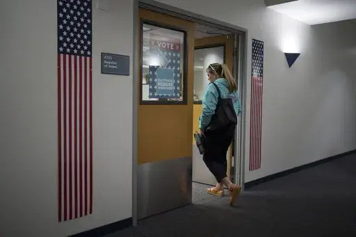 Cari-Ann Burgess, interim Registrar of Voters for Washoe County, Nev., arrives at the office Saturday, Sept. 21, 2024, in Reno, Nev. (AP Photo/John Locher)