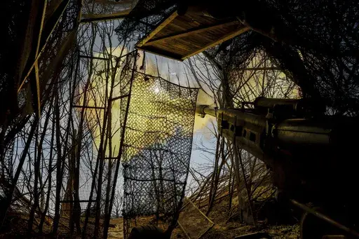 Ukrainian servicemen fire a M777 howitzer towards Russian positions at the front line near Donetsk, Ukraine, Monday, March 3, 2025. (AP Photo/Roman Chop)