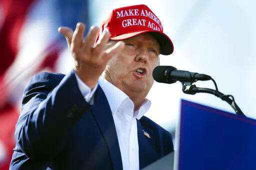 Former President Donald Trump speaks from the podium during a campaign rally, on May 1, 2022, in Greenwood, Neb. Trump must answer questions under oath in New York state's civil investigation into his business practices, a state appeals court ruled Thursday, May 26, 2022. (Kenneth Ferriera/Lincoln Journal Star via AP, File)