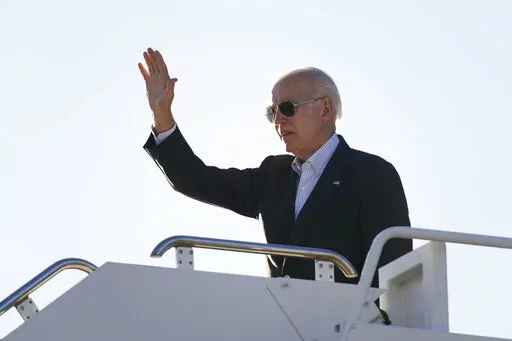 President Joe Biden waves before boarding Air Force One at El Paso International Airport in El Paso, Texas, Sunday, Jan. 8, 2023, to travel to Mexico City, Mexico. The Justice Department is reviewing a batch of potentially classified documents found in the Washington office space of President Joe Biden's former institute, the White House said Monday, Jan. 9. (AP Photo/Andrew Harnik)