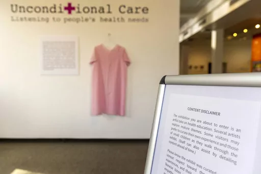 A content disclaimer sits at the entrance to the Unconditional Care exhibit Monday, March 6, 2023, at the Lewis-Clark State College Center for Arts & History in Lewiston, Idaho. Artists said some of their works weren't allowed in the exhibit by LCSC, which cited Idaho's No Public Funds for Abortion for removing some of the pieces. In Idaho, an art exhibit was censored and teens were told they couldn't testify in some legislative hearings. In Washington, a lawmaker proposed a hotline for reportin