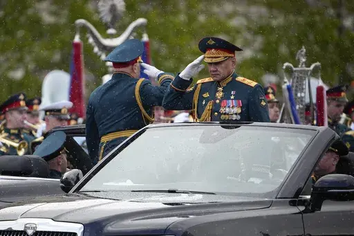 Russian Defense Minister Sergei Shoigu is driven along Red Square in an Aurus car during the Victory Day military parade in Moscow, Russia, Thursday, May 9, 2024, marking the 79th anniversary of the end of World War II. (AP Photo/Alexander Zemlianichenko)