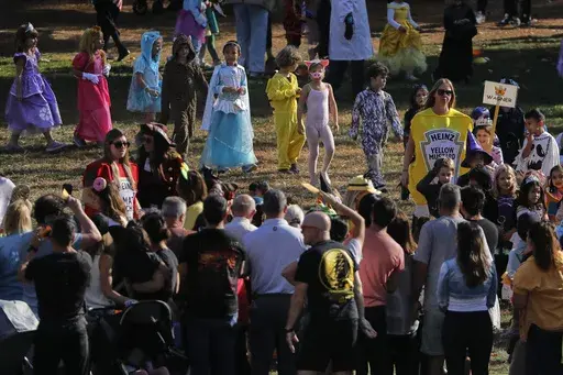 Children at Daniel Warren Elementary School walk in a Halloween parade, Thursday, Oct. 31, 2024, in Mamaroneck, N.Y. (AP Photo/Julie Jacobson)