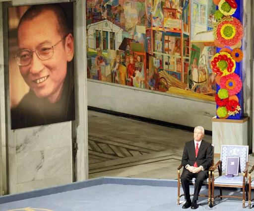 Nobel Commitee chairman Thorbjorn Jagland sits next to an empty chair with the Nobel Peace Prize medal and diploma during a ceremony honoring Nobel Peace Prize laureate Liu Xiaobo at city hall in Oslo, Norway, on Dec. 10, 2010. Liu was serving an 11-year sentence for inciting subversion by advocating sweeping political reforms and greater human rights in China. (AP Photo/John McConnico, File)
