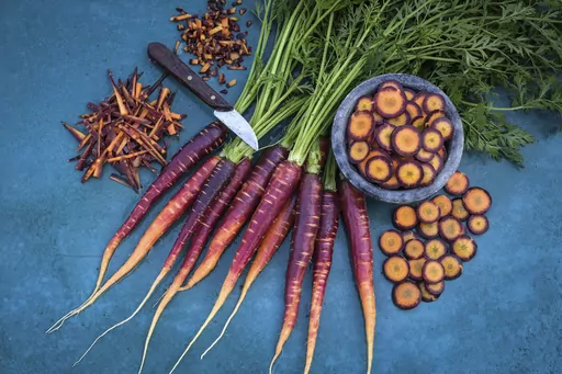 This image provided by Baker Creek Heirloom Seed Co. shows Lila Lu Sang carrots, which are deep purple on the outside and bright orange on the inside. (Baker Creek Heirloom Seed Co./rareseeds.com via AP)
