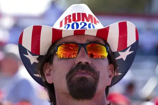 Frank Garner waits for the start of former President Donald Trump's rally in Perry, Ga., on Sept. 25, 2021. (AP Photo/Ben Gray, File)