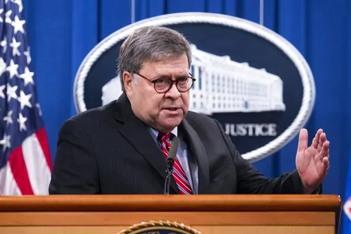 Then-Attorney General William Barr speaks during a news conference, Dec. 21, 2020, at the Justice Department in Washington. Justice Department officials who evaluated then-President Donald Trump's actions during the Russia investigation concluded that nothing he did, including firing the FBI director, rose to the level of obstruction of justice and that there was no precedent for a prosecution.(Michael Reynolds/Pool via AP, File)
