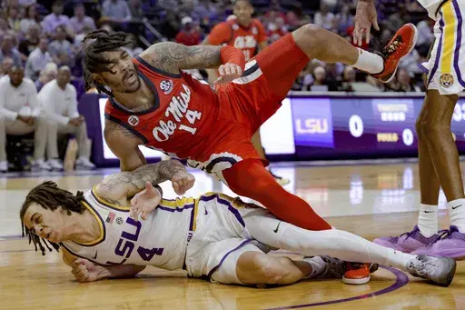 Mississippi guard Dre Davis (14) falls on LSU guard Dji Bailey (4) as they both came down attempting a rebound during the first half an NCAA college basketball game in Baton Rouge, La., Saturday, Feb. 8, 2025. (AP Photo/Matthew Hinton)