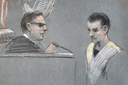 This artist depiction shows Massachusetts Air National Guardsman Jack Teixeira, right, appearing in U.S. District Court in Boston, April 14, 2023. Teixeira has been indicted on federal felony charges. The Justice Department says Teixeira faces six counts in the indictment of willful retention and transmission of national defense information. (Margaret Small via AP, File)