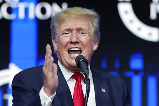 In this July 24, 2021, photo, former President Donald Trump speaks to supporters at a Turning Point Action gathering in Phoenix. Trump remains the most popular figure with the GOP base as he considers another bid for the White House. He's flexing the power of his endorsement in several high-profile midterm contests. (AP Photo/Ross D. Franklin)