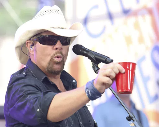 Country music recording artist Toby Keith holds a red Solo cup as he performs on NBC's Today show at Rockefeller Plaza on July 5, 2019, in New York. Keith, who died Monday at 62, immortalized the humble plastic cups in his 2011 hit "Red Solo Cup."(Photo by Greg Allen/Invision/AP, File)