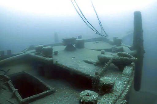In this image taken from video provided by the Thunder Bay National Marine Sanctuary, the bow of the Ironton is seen in Lake Huron off Michigan's east coast in a June 2021 photo. Searchers have found the long-lost Great Lakes ship that came to a tragic end. Officials with the sanctuary in Alpena, Mich,, say they've located the Ironton, a freight schooner that plunged to the bottom of Lake Huron in 1894. The Ironton collided with another vessel in rough seas. Reports at the time said the seven-me