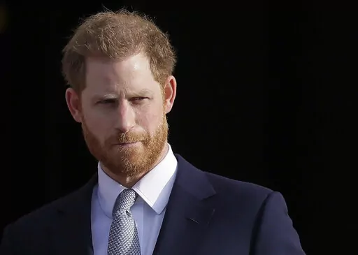 Britain's Prince Harry arrives in the gardens of Buckingham Palace in London, Jan. 16, 2020. Prince Harry has filed a claim for a judicial review against the British government’s decision not to let him personally pay for police protection while in the U.K. The Duke of Sussex’s legal representative said Saturday, Jan. 15, 2022 that Harry wants to bring his children Archie and Lilibet to visit his home country from the U.S. but that is too risky without police protection. (AP Photo/Kirsty Wig