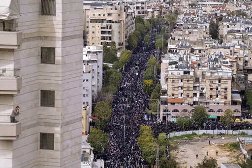 Hundreds of thousands of people attend the funeral of prominent ultra-Orthodox Rabbi Chaim Kanievsky in Bnei Brak, Israel Sunday, March 20, 2022. Kanievsky was one of the most influential scholars in the religious community in Israel. He died Friday at the age of 94. (AP Photo/Oded Balilty)