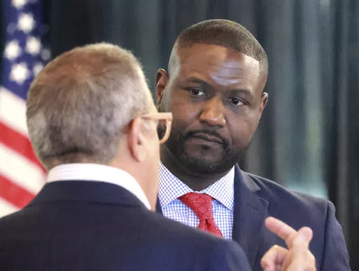Central Florida Tourism Oversight District board administrator Glen Gilzean listens to chairman Martin Garcia, left, during the board's meeting in the headquarters of the former Reedy Creek Improvement District at Walt Disney World in Lake Buena Vista, Fla., Aug. 23, 2023. Less than a year after being picked to lead Walt Disney World's government after it was taken over by Gov. Ron DeSantis' allies, the district's administrator was appointed by the Florida governor on Monday, March 4, 2024 to ru