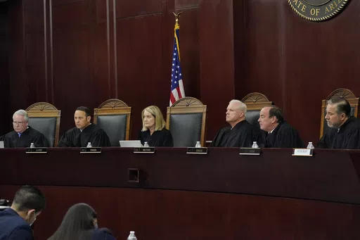 Arizona Supreme Court Justices from left; William G. Montgomery, John R Lopez IV, Vice Chief Justice Ann A. Scott Timmer, Chief Justice Robert M. Brutinel, Clint Bolick and James Beene listen to oral arguments on April 20, 2021, in Phoenix. The Arizona Supreme Court ruled Tuesday, April 9, 2024, that the state can enforce its long-dormant law criminalizing all abortions except when a mother’s life is at stake. (AP Photo/Matt York, File)
