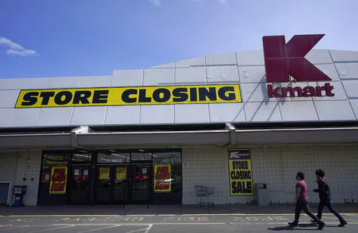 People walk into a Kmart in Avenel, N.J., Monday, April 4, 2022. When the New Jersey store closes its doors on April 16, it will leave only three remaining U.S. locations for the former retail powerhouse. It's a far cry from the chain's heyday in the 1980s and ‘90s when it had more than 2,000 stores and sold product lines endorsed by Martha Stewart and former “Charlie's Angel” Jaclyn Smith. (AP Photo/Seth Wenig)