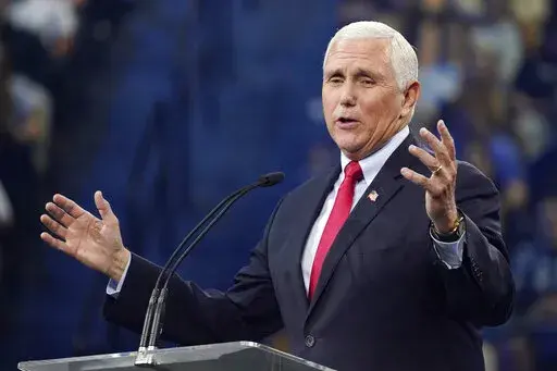 Former Vice President Mike Pence gestures as he addresses the Convocation at Liberty University, Sep. 14, 2022, in Lynchburg, Va. By refusing to go along with  former president Donald Trump’s unconstitutional push to overturn the results of the 2020 election, Pence became a leading target of Trump’s wrath and a pariah in many Republican circles. But in the final weeks of an intensely competitive midterm election, Pence’s fortunes may be shifting. He’s an in-demand surrogate for Republica