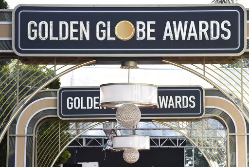 Event signage appears above the red carpet at the 77th annual Golden Globe Awards on Jan. 5, 2020, in Beverly Hills, Calif. The 80th annual Golden Globe Awards will take place on Tuesday, Jan. 10. (Photo by Jordan Strauss/Invision/AP, File)