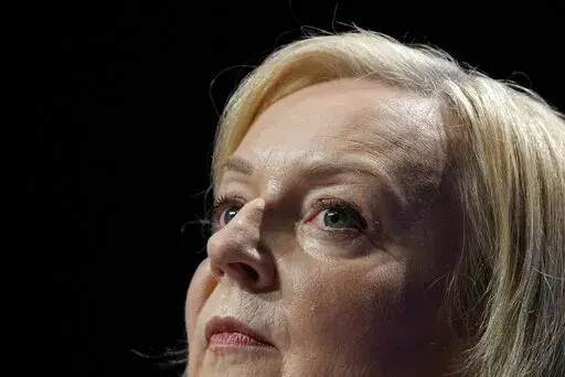 Britain's Prime Minister Liz Truss makes a speech at the Conservative Party conference at the ICC in Birmingham, England, Wednesday, Oct. 5, 2022. Truss has only been in office for six weeks. But already her libertarian economic policies have triggered a financial crisis, emergency central bank intervention, multiple U-turns and the firing of her Treasury chief. (AP Photo/Kirsty Wigglesworth, File)