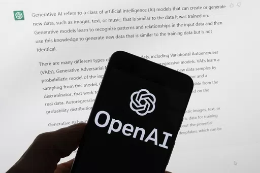 The OpenAI logo is seen on a mobile phone in front of a computer screen displaying output from ChatGPT, on March 21, 2023, in Boston. Italian regulators said they informed OpenAI that its ChatGPT artificial intelligence chatbot has violated European Union’s stringent data privacy rules. The country’s data protection authority, known as Garante, said Monday, Jan. 29, 2024, that it notified San Francisco-based OpenAI of breaches of the EU rules, known as General Data Protection Regulation. (AP